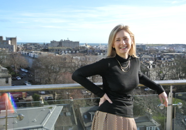 Spirit Energy's Sarah Willis at a balcony, smiling for the camera